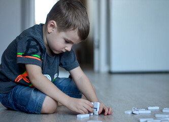 boy playing domino