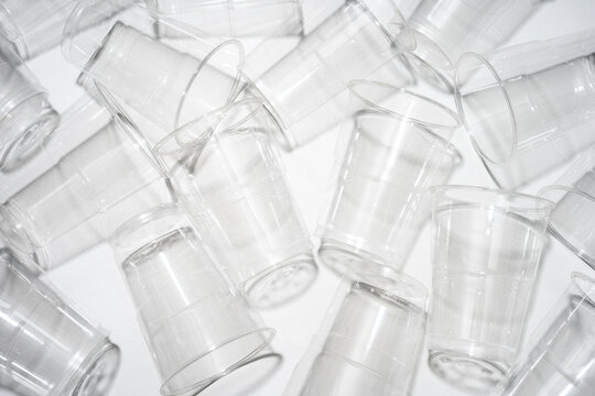 Group Of Clear Plastic Cups On White Background