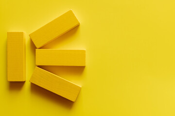 top view of bright colored blocks on yellow background.