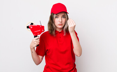 pretty caucasian woman making capice or money gesture, telling you to pay. packer concept