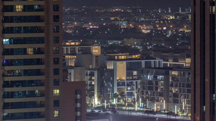 Fototapeta na wymiar City Walk district aerial night timelapse, new urban area near Dubai downtown.