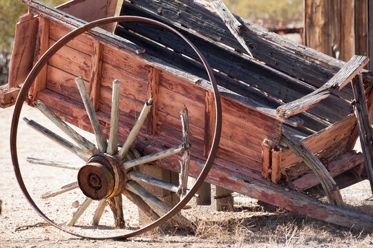 Old broken wagon in the desert