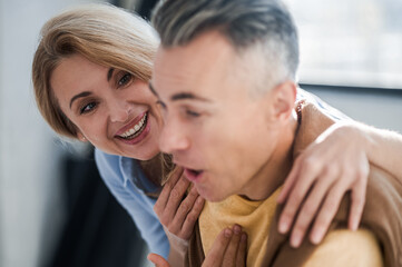 A couple in the office looking interetsed while reading news