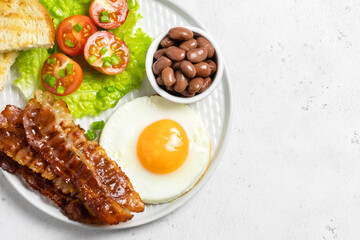 English breakfast on plate. Top view, copy space.