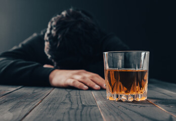 sad man with glass of alcohol