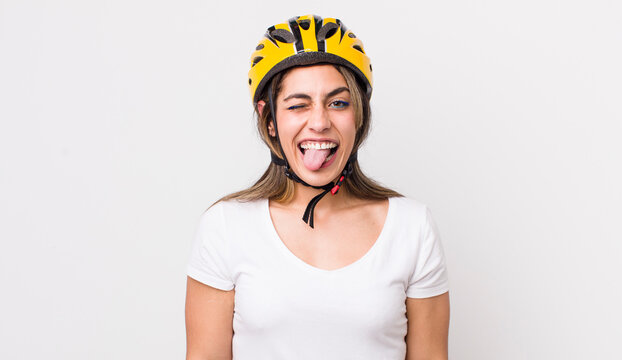 Pretty Hispanic Woman With Cheerful And Rebellious Attitude, Joking And Sticking Tongue Out. Bicycle Concept