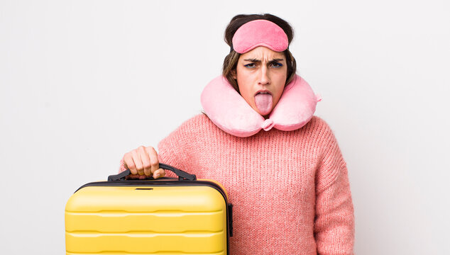 Pretty Hispanic Woman Feeling Disgusted And Irritated And Tongue Out. Flight Passenger Concept