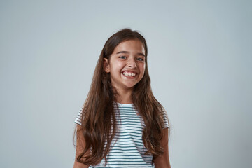 Fototapeta premium Portrait of european little girl looking at camera