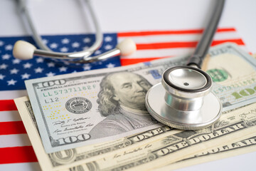 Black stethoscope with US dollar banknotes on USA America flag background, Business and finance concept.
