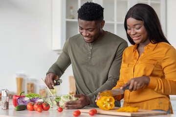 Cooking Together. Young African American Lovers Preparing Food In Kitchen