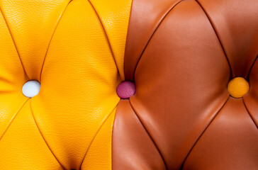 Multicolor leather texture with buttons. Leather upholstery pattern with buttons