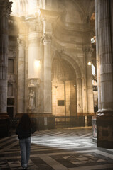 Girl walking inside the cathedral of Cádiz © Juan Martínez 