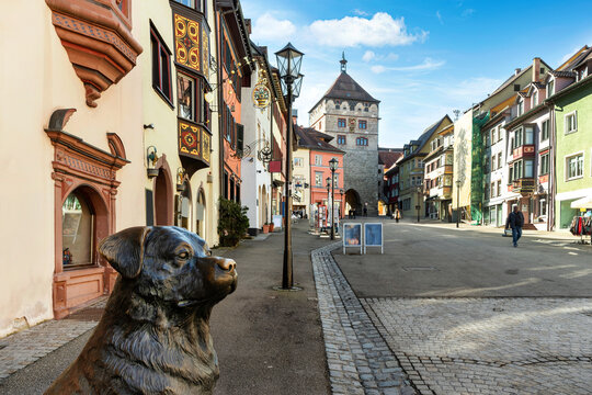 View to the Black Gate in the idyllic old town of Rottweil, Black Forest, Germany. In the foreground a statue of Rottweil.
