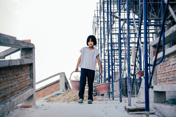 Children are forced to work in the construction area. Human rights concepts stop child abuse,...