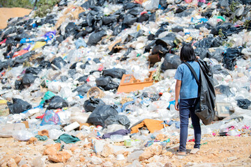 poor boy picking up trash concept of poverty Violence against children and human trafficking...