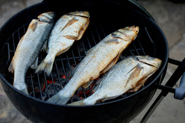 Spicy grilled fish with lemon. Food preparation for restaurant menu..