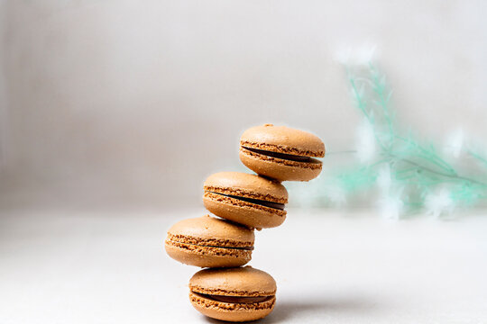 Colorful french pastries called macarons on light background
