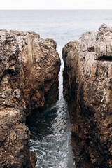 Fototapeta na wymiar Beautiful view to ocean rocky cliffs in Cascais