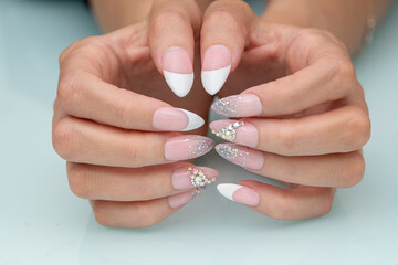 Nail Design . Manicure nail paint . Beautiful female hand with colorful nail art design manicure....