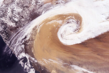 Sandstorm from space. Elements of this image furnished by NASA