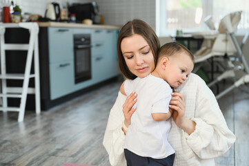 Portrait of a loving caring mother and a one and a half year old child. Motherhood is the highest manifestation of love