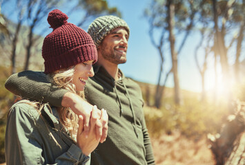 Bonding on the trails. Cropped shot of an affectionate young couple hiking.