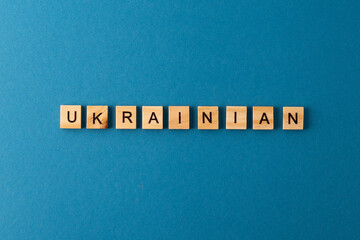 Ukrainian background. Phrase from wooden letters. Top view words. The phrases is laid out in wood letter. Motivation.