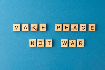 Make peace not war background. Phrase from wooden letters. Top view words. The phrases is laid out in wood letter. Motivation.
