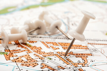 A paper clip on the map shows the end point of the route. Travel guide. Map of the city, area