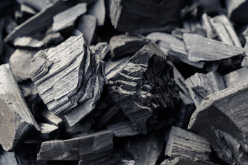 Black natural charcoal pile close-up