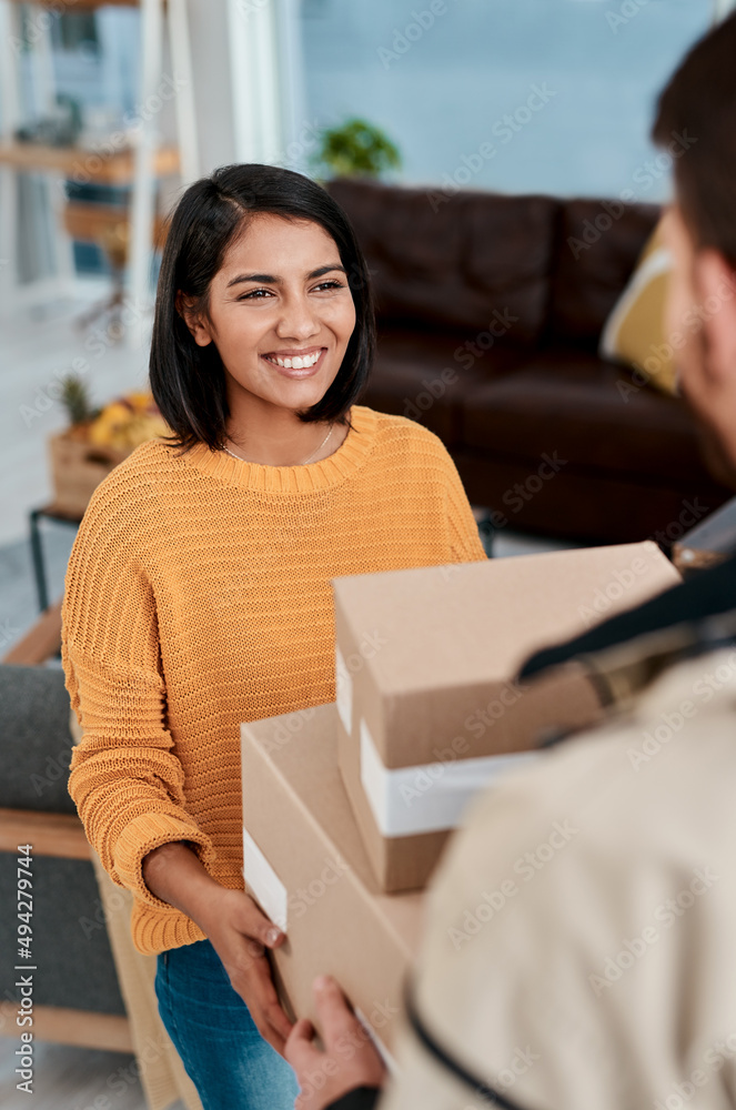 Sticker If theyre smiling, they did a good job. Shot of a young woman receiving a package from a delivery man at home.