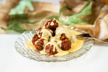 Baked meat ball with lemon sauce, scarf.