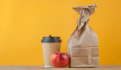brown paper bag on wooden background