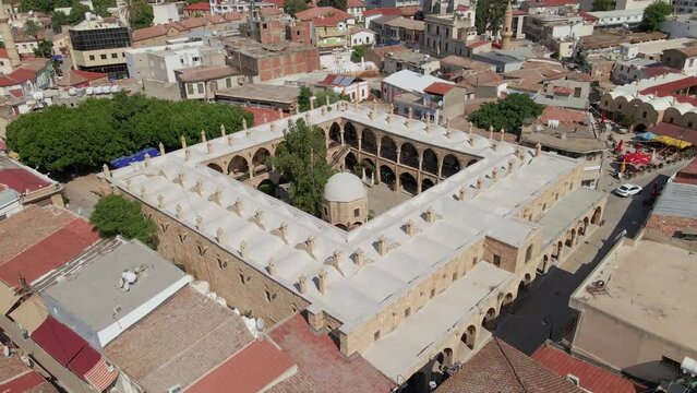 Aerial 4k Nicosia Old Town with Great Inn(B&uuml;y&uuml;k Han) which is build as cervansarai by Ottoman Period in North Cyprus