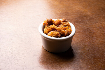 pork rinds on wooden table