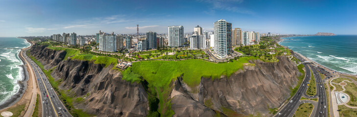 LIMA, PERU: Aerial view of Miraflores town, cliff and the Costa Verde high way © christian vinces