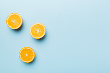 fresh Fruit orange slices on colored background. Top view. Copy Space. creative summer concept. Half of citrus in minimal flat lay with copy space