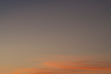 The sky before dawn was clear with an orange horizon and a blue atmosphere. orange dawn sky smooth orange gradient background of the start of the day Morning paradise with copy space. Sunset. Sunrise 