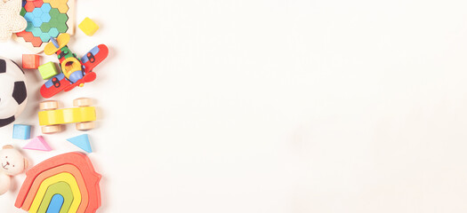 Baby kids toys frame on white background. Many colorful educational toys. Top view, flat lay