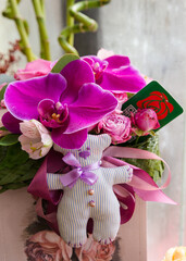 A beautiful bright bouquet of fresh blooming orchids for a gift collected by an experienced florist