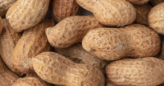 Closeup, top view of shelled peanuts. Food backdrop