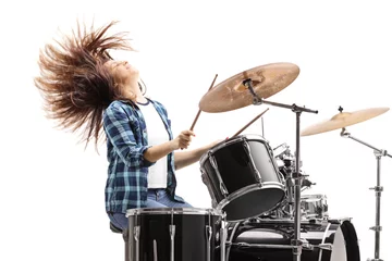 Fotobehang Energetic female drummer playing on a drum set © Ljupco Smokovski