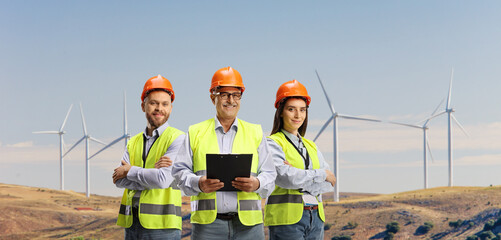 Team of engineers on a wind farm