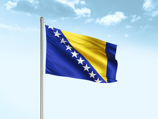 Bosnia and Herzegovina national flag waving in blue sky with clouds. Bosnia and Herzegovina flag. 3D illustration