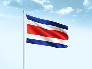 Fototapeta na wymiar Costa Rica national flag waving in blue sky with clouds. Costa Rica flag. 3D illustration