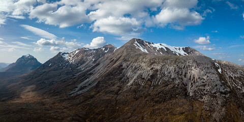 aerial view of the torridon mountains in the north west highlands of scotland during a clear blue spring day