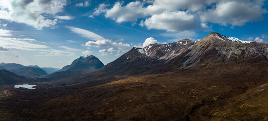 aerial view of the torridon mountains in the north west highlands of scotland during a clear blue spring day