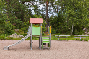Beautiful view of slide on empty playground on summer day. Sweden.