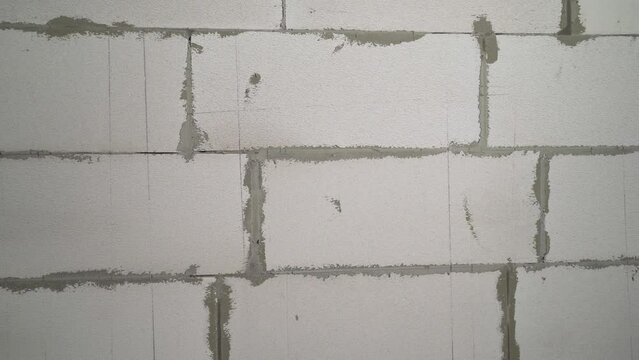 Wall of white foam blocks. New wall of foam concrete bricks.