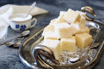 Apple gelatin dessert. Sugar free. Homemade marshmallow cubes in coconut flakes